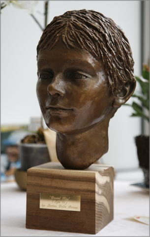 bronze sculpture of boy's head