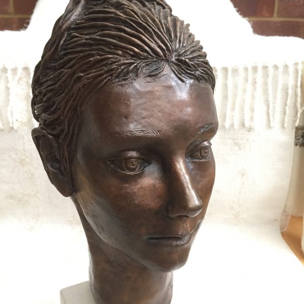 portrait in bronze of young woman