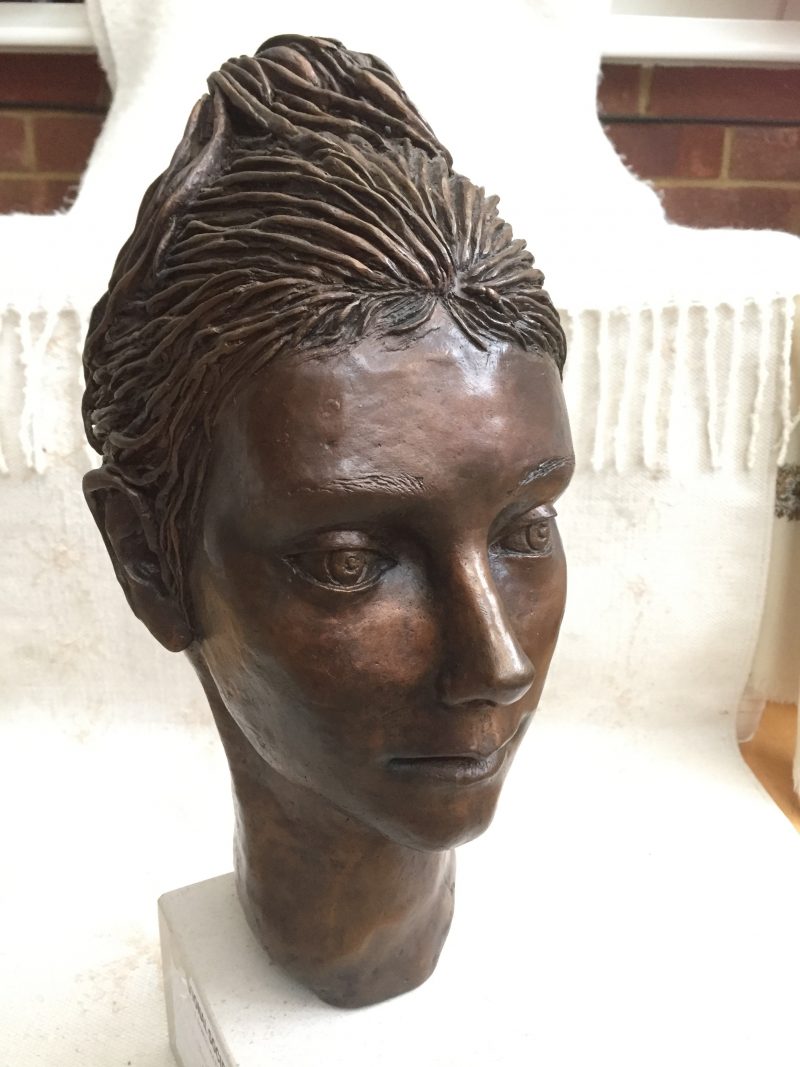 portrait in bronze of young woman